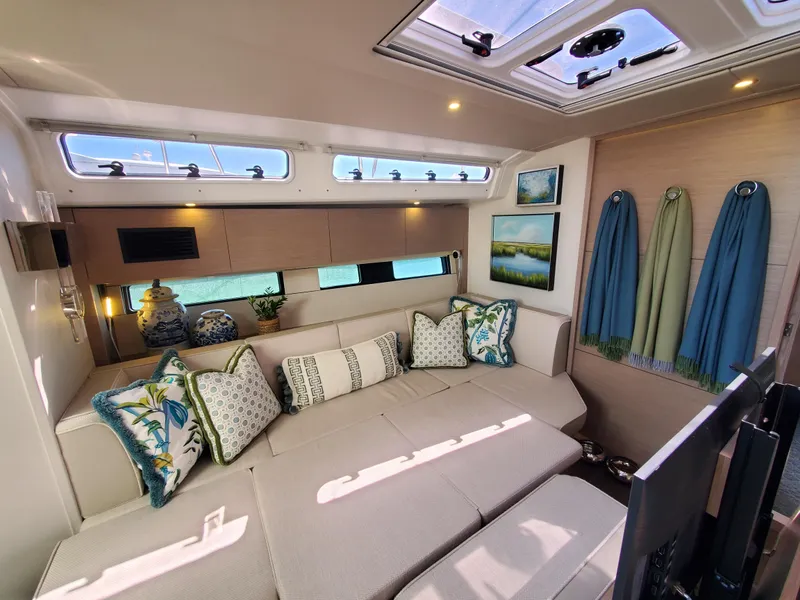 Slide: The Image of Luxurious interior of 2023 Hanse 460 yacht with elegant seating and decorative pillows. - 21