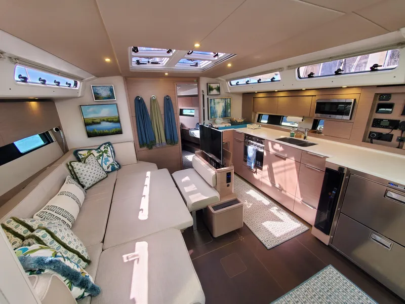 Slide: The Image of Luxurious interior of 2023 Hanse 460 yacht with modern kitchen and cozy seating area. - 22