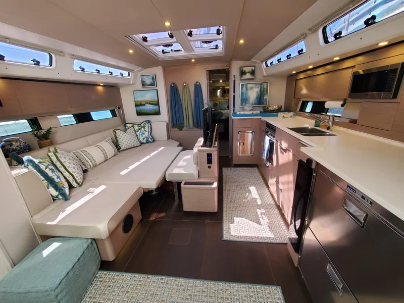 Slide: The Image of Luxurious interior of 2023 Hanse 460 yacht with modern kitchen and comfortable seating area. - 24