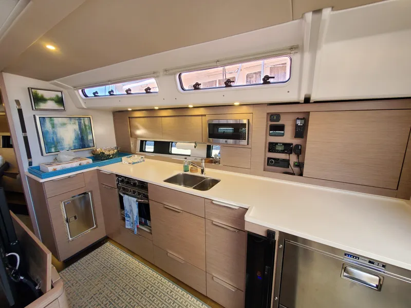 Slide: The Image of Modern kitchen interior of 2023 Hanse 460 yacht with sleek cabinetry and appliances. - 25