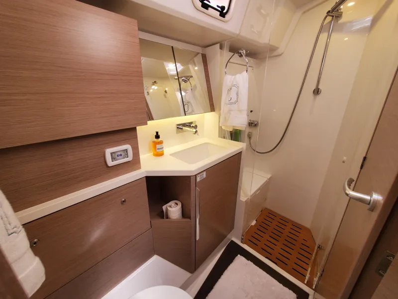 Slide: The Image of Modern bathroom in 2023 Hanse 460 yacht with wooden cabinetry and sleek shower design. - 28