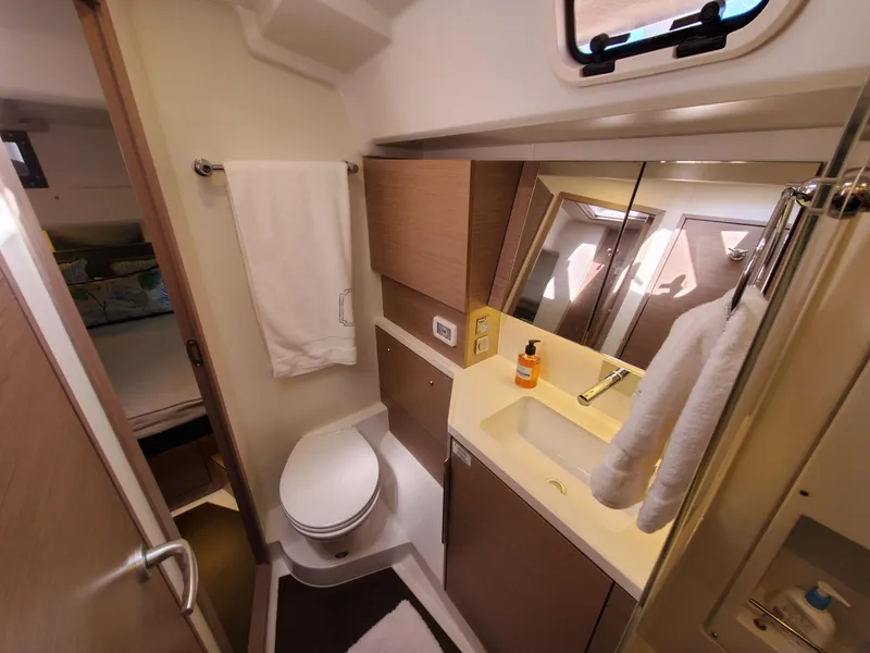 Slide: The Image of Modern bathroom in 2023 Hanse 460 yacht with sink, toilet, and mirror. - 30