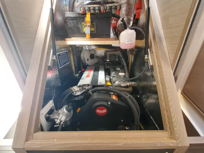 Slide: The Image of Engine compartment of 2023 Hanse 460 yacht, showcasing mechanical components and storage. - 32