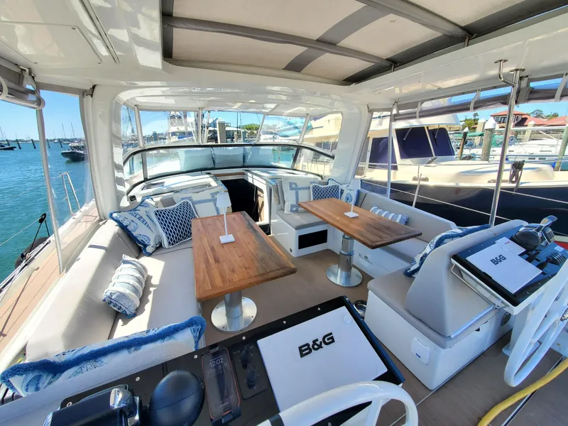 Slide: The Image of Luxurious 2023 Hanse 460 yacht interior with elegant seating and wooden tables. - 40
