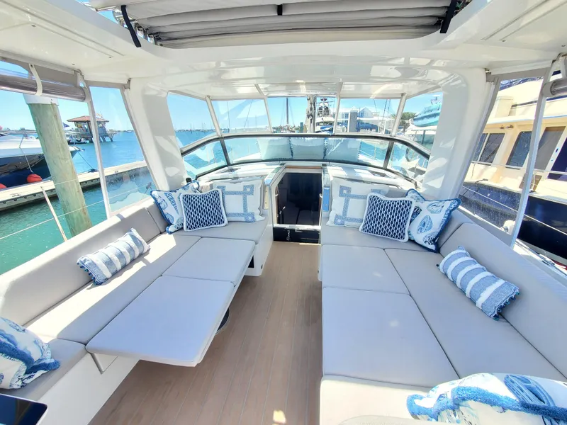 Slide: The Image of Luxurious 2023 Hanse 460 yacht interior with plush seating and nautical-themed cushions. - 42