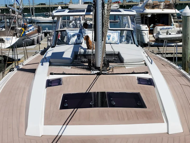 Slide: The Image of 2023 Hanse 460 yacht docked at marina, featuring spacious deck and modern design. - 50