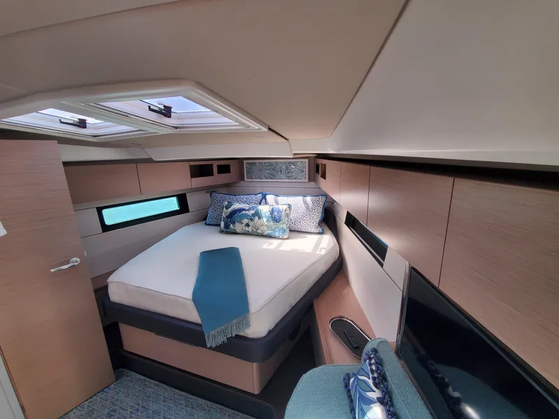 Slide: The Image of Luxurious cabin interior of 2023 Hanse 460 yacht with modern design and cozy bedding. - 6