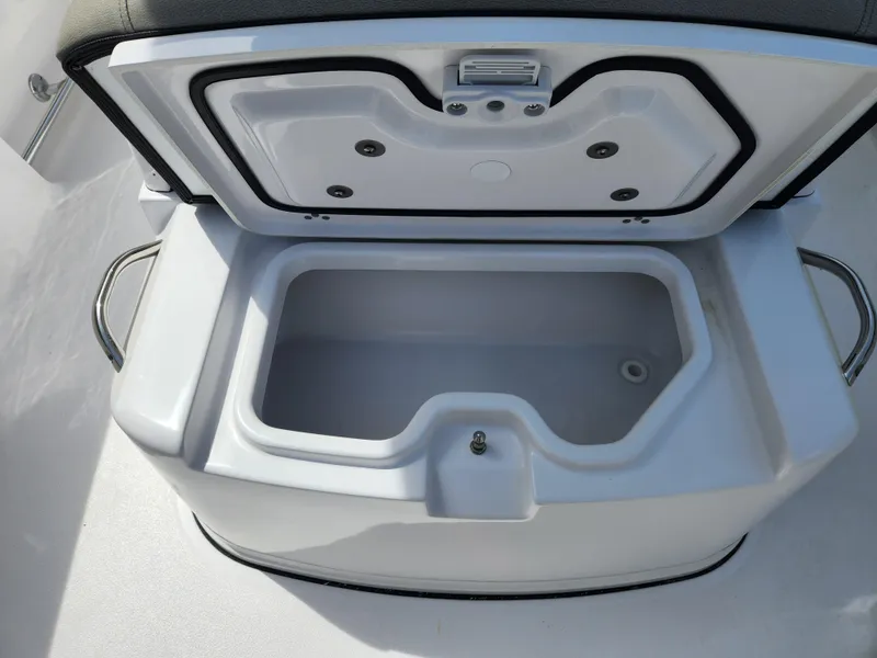 Slide: The Image of Open storage compartment on 2025 Sportsman Heritage 261 Center Console boat. - 11