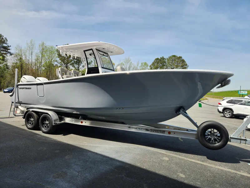 Slide: The Image of 2025 Sportsman Heritage 261 Center Console boat on trailer, parked outdoors. - 7
