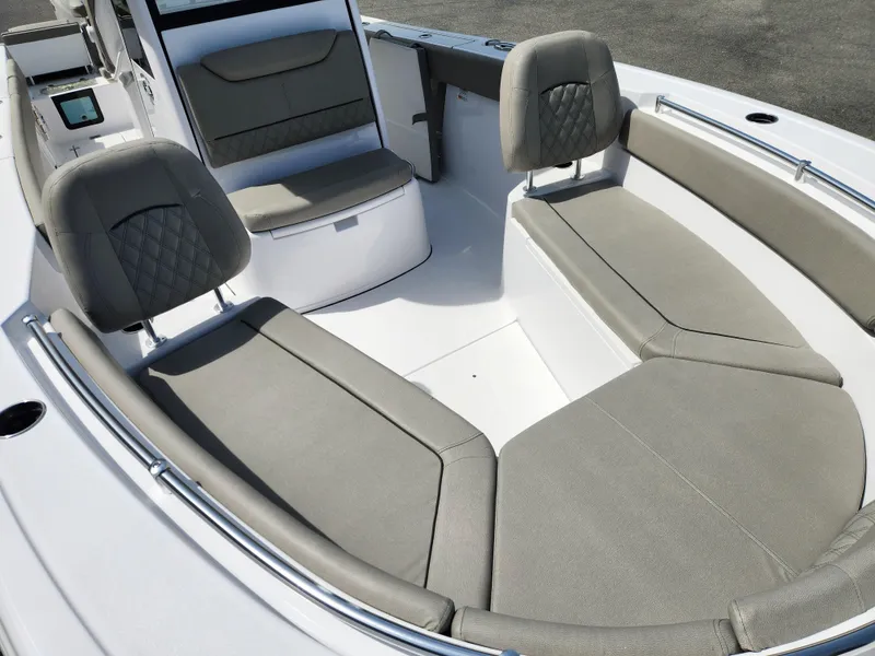 Slide: The Image of 2025 Sportsman Heritage 261 Center Console boat interior with gray seating and modern design. - 9