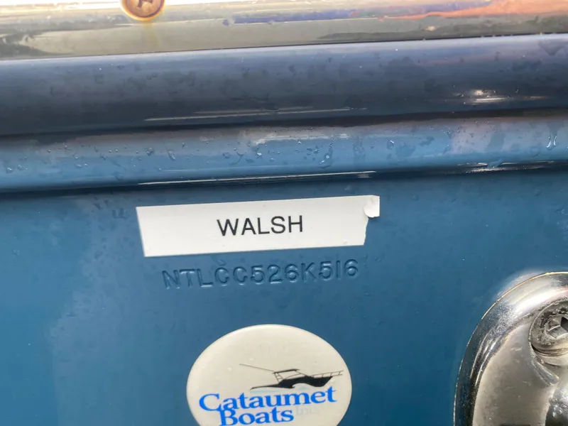 Slide: The Image of 2016 Grady-White Canyon boat with "Walsh" label and Cataumet Boats sticker. - 20