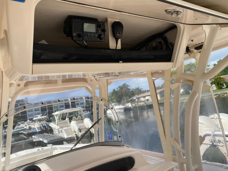 Slide: The Image of Interior view of a 2016 Grady-White Canyon boat with radio equipment. - 9