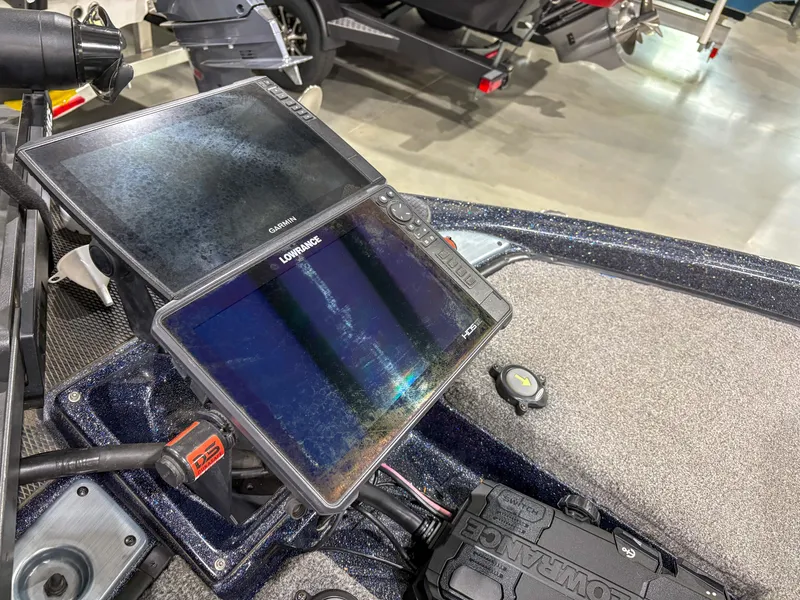 Slide: The Image of Dual fish finders on a 2020 Phoenix 921 ELITE boat dashboard. - 12