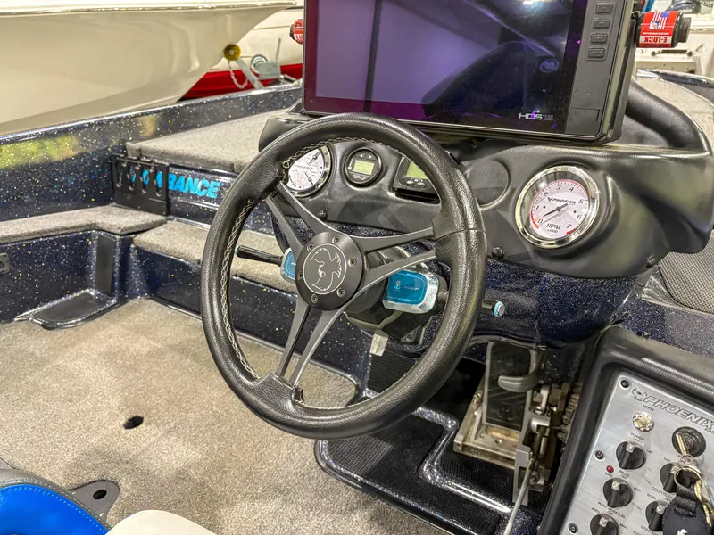 Slide: The Image of Steering wheel and dashboard of 2020 Phoenix 921 ELITE boat with modern controls. - 15