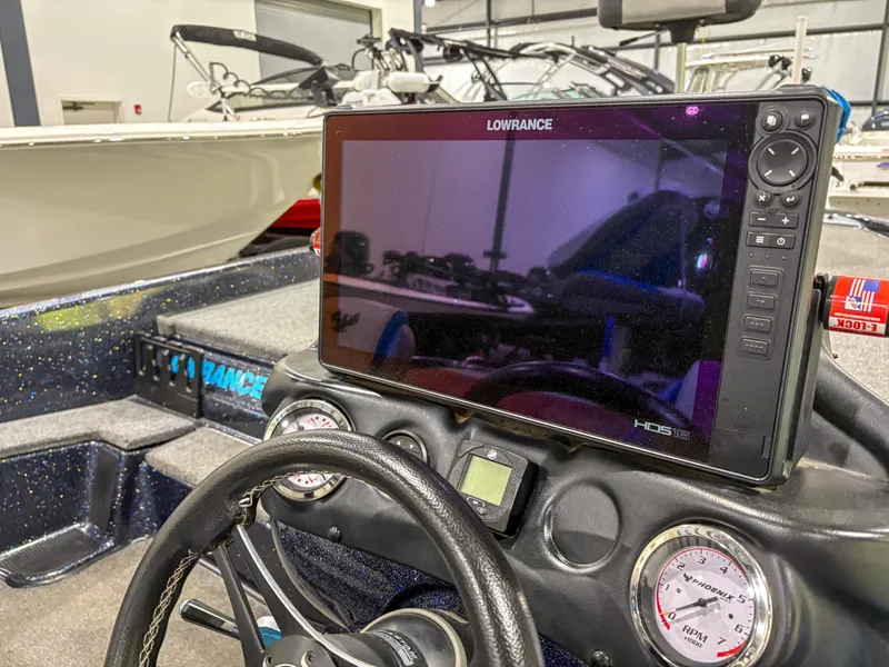 Slide: The Image of 2020 Phoenix 921 ELITE boat dashboard with Lowrance HDS display and steering wheel. - 16