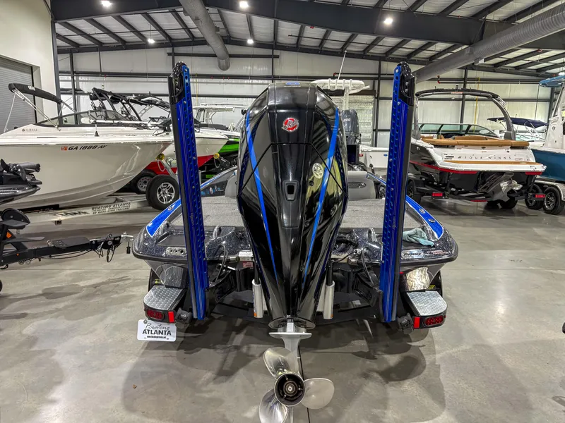 Slide: The Image of 2020 Phoenix 921 ELITE boat in showroom, rear view with motor and propeller. - 5