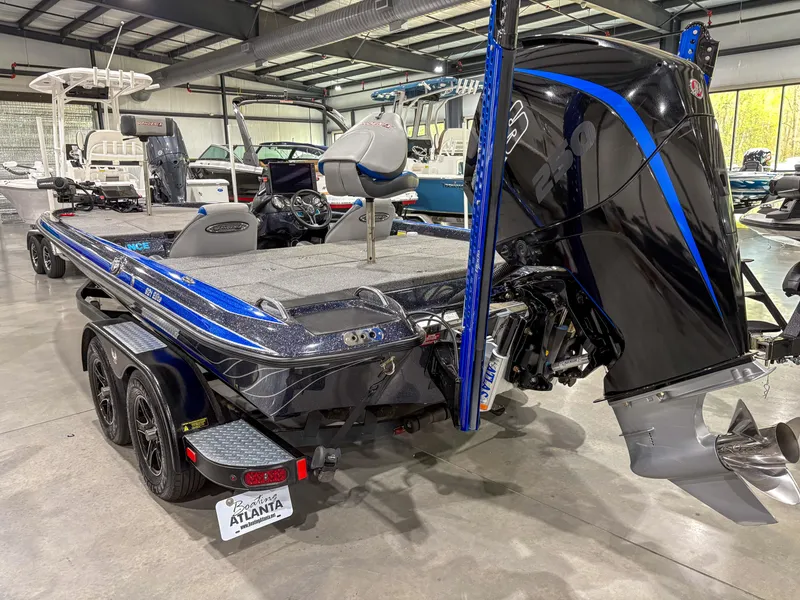 Slide: The Image of 2020 Phoenix 921 ELITE bass boat with dual axle trailer in showroom. - 6