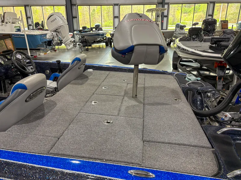 Slide: The Image of 2020 Phoenix 921 ELITE boat interior with seating and storage compartments. - 7