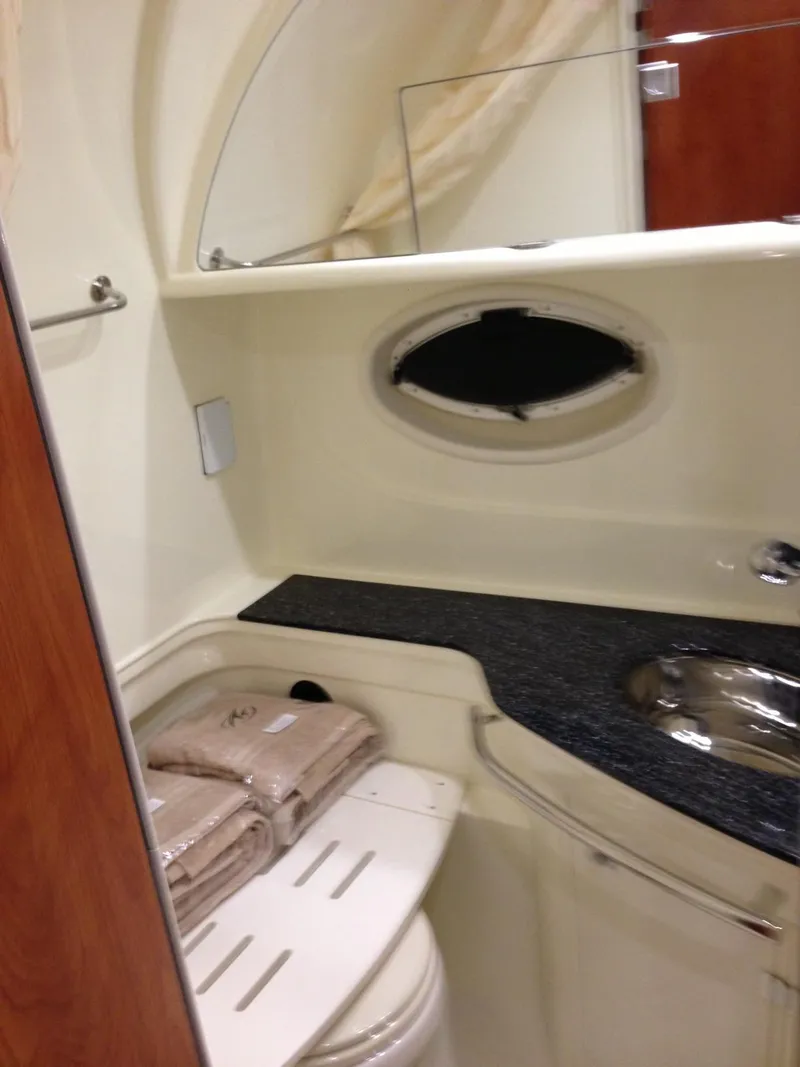 Slide: The Image of 2013 Monterey 340 SY bathroom with sink, mirror, and towels. - 20