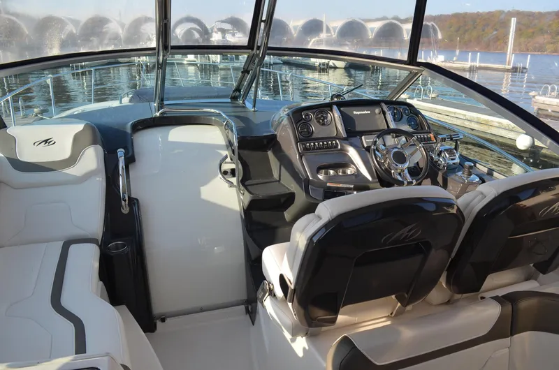 Slide: The Image of 2013 Monterey 340 SY yacht interior with modern dashboard and seating. - 8