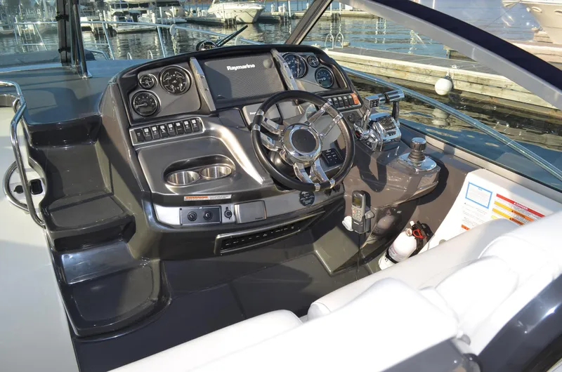 Slide: The Image of Cockpit of 2013 Monterey 340 SY boat with modern controls and steering wheel. - 9