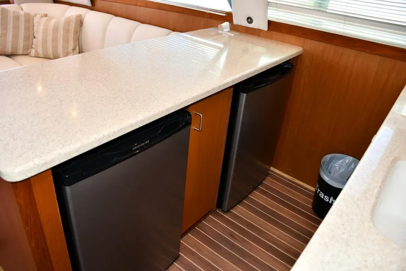 Slide: The Image of Interior of 2001 Ocean Yachts 43 Super Sport with dual mini-fridges and countertop. - 14