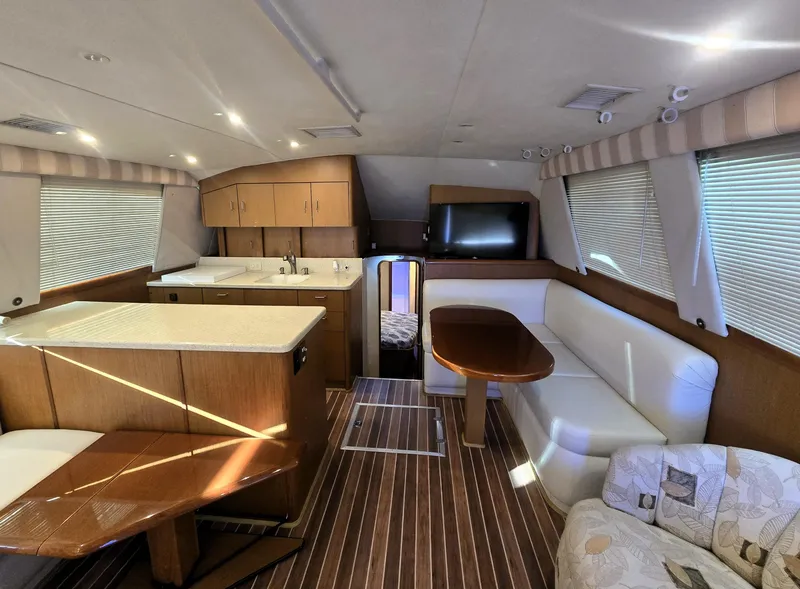Slide: The Image of Interior of 2001 Ocean Yachts 43 Super Sport with modern kitchen and seating area. - 17