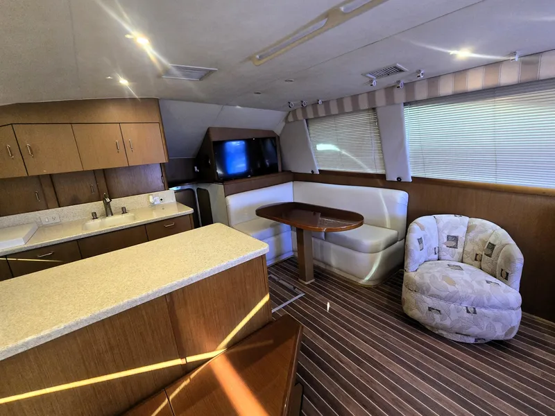 Slide: The Image of Interior of 2001 Ocean Yachts 43 Super Sport with modern kitchen and cozy seating area. - 18