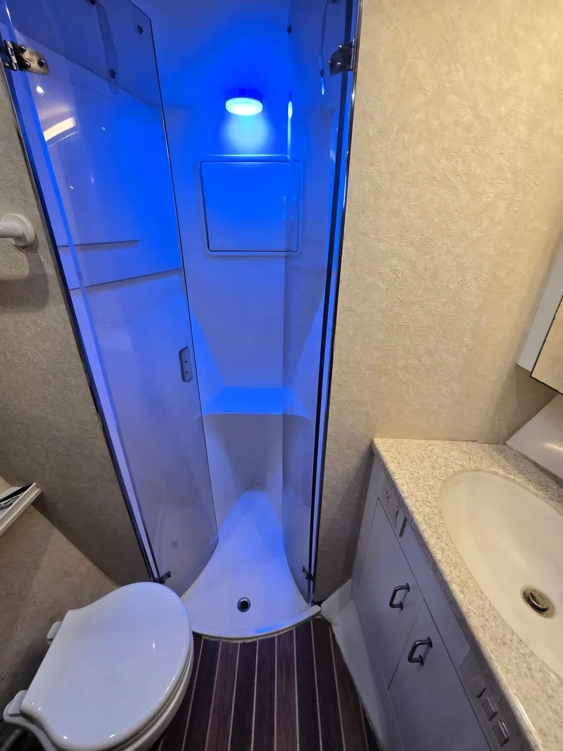 Slide: The Image of Bathroom interior of 2001 Ocean Yachts 43 Super Sport with blue-lit shower. - 21