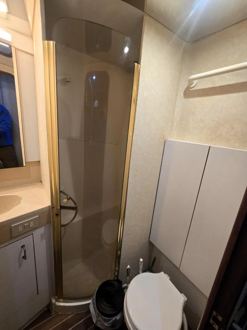 Slide: The Image of Bathroom interior of 2001 Ocean Yachts 43 Super Sport with shower and toilet. - 24