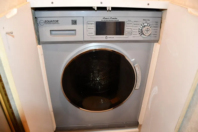 Slide: The Image of Compact Equator washer-dryer unit in Ocean Yachts 43 Super Sport, 2001 model. - 26