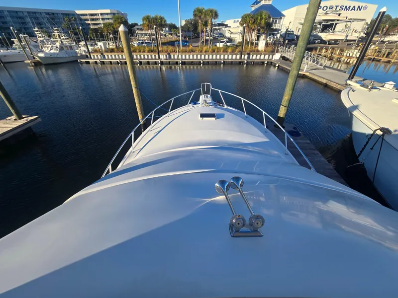 Slide: The Image of 2001 Ocean Yachts 43 Super Sport docked at marina, view from bow. - 6
