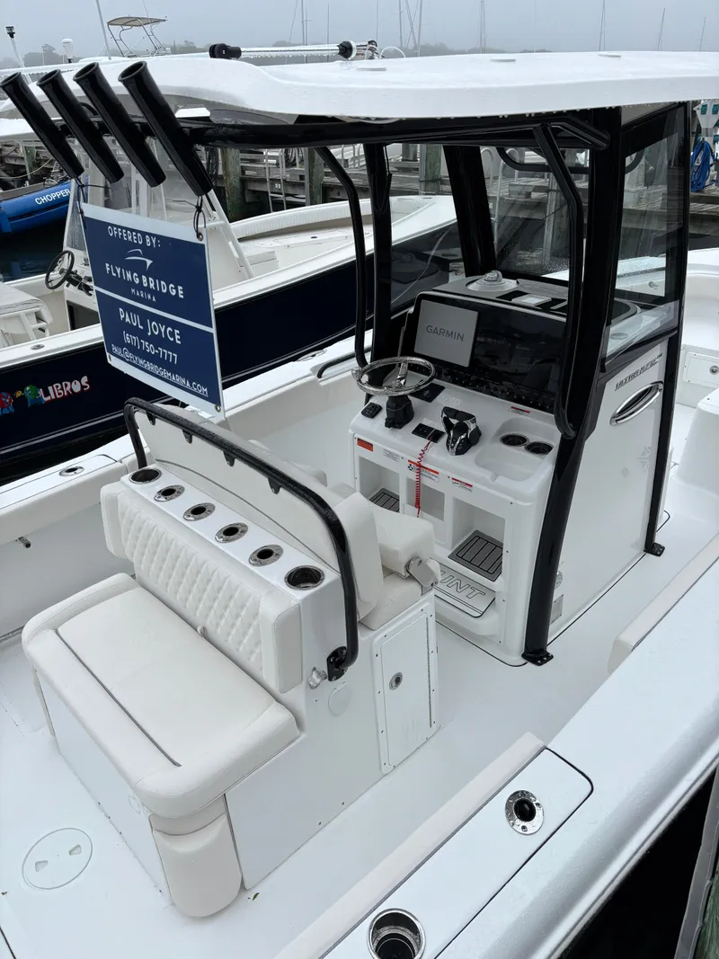 Slide: The Image of 2025 Sea Hunt Ultra 275 SE boat with modern helm and seating. - 2