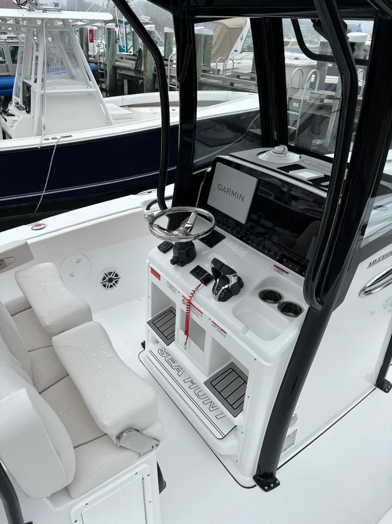 Slide: The Image of 2025 Sea Hunt Ultra 275 SE boat cockpit with modern controls and seating. - 5