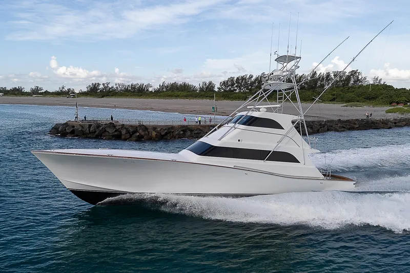 Slide: The Image of 2001 American Custom Enclosed Flybridge yacht cruising on open water. - 0