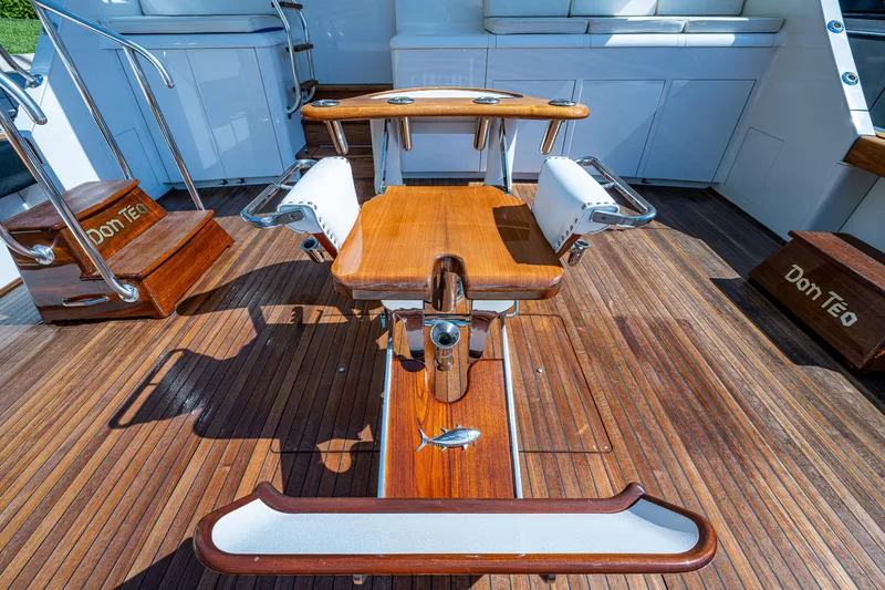 Slide: The Image of 2001 American Custom Enclosed Flybridge with wooden deck and fishing chair. - 16