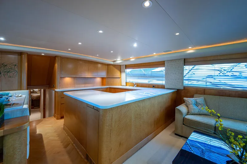 Slide: The Image of Luxurious interior of a 2001 American Custom Enclosed Flybridge yacht with modern furnishings. - 31