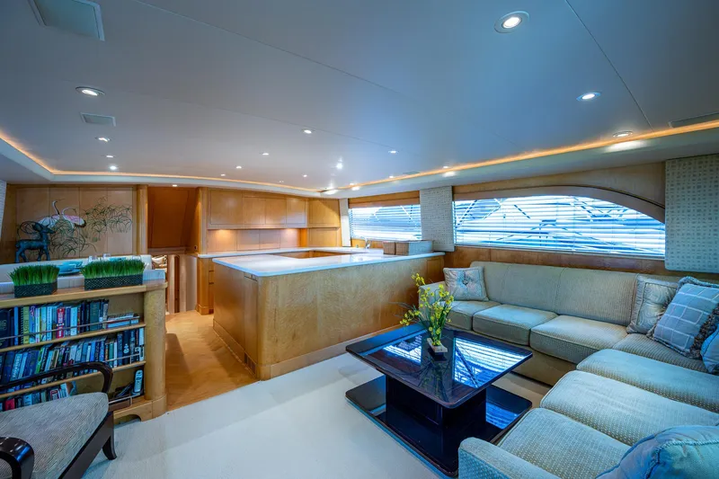 Slide: The Image of Luxurious interior of a 2001 American Custom Enclosed Flybridge yacht with elegant seating and decor. - 32