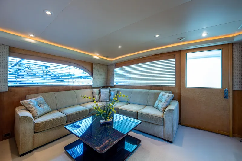 Slide: The Image of Luxurious interior of a 2001 American Custom Enclosed Flybridge yacht with plush seating and elegant decor. - 33