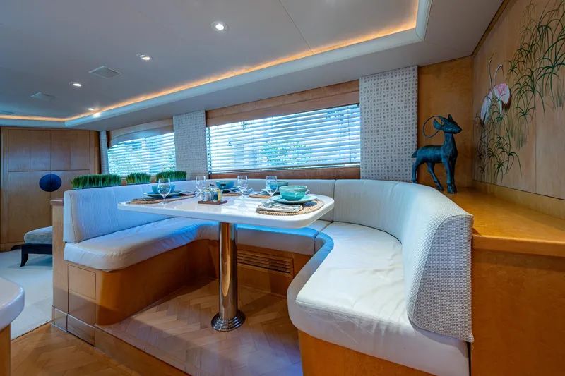 Slide: The Image of Luxurious dining area in a 2001 American Custom Enclosed Flybridge yacht, featuring elegant decor. - 34