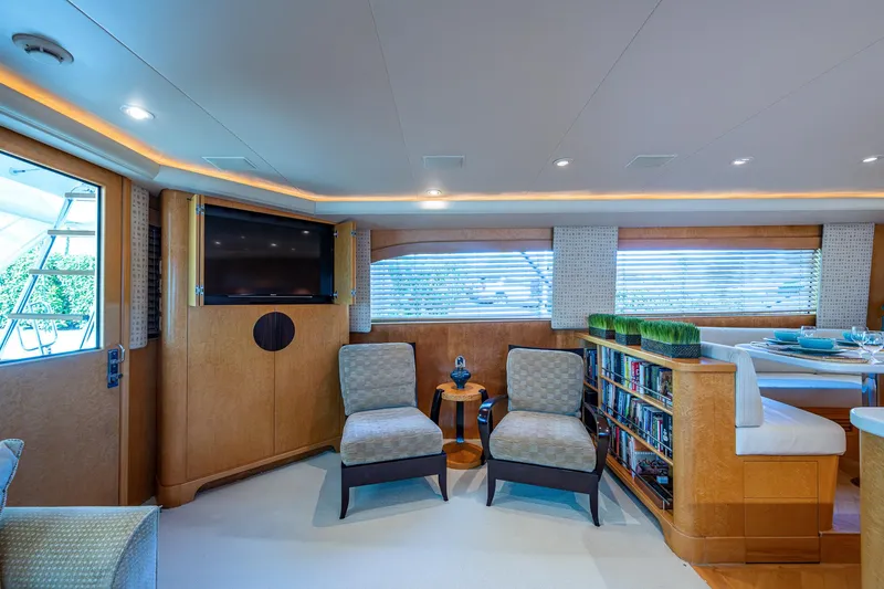 Slide: The Image of Luxurious interior of a 2001 American Custom Enclosed Flybridge yacht with elegant seating and decor. - 35
