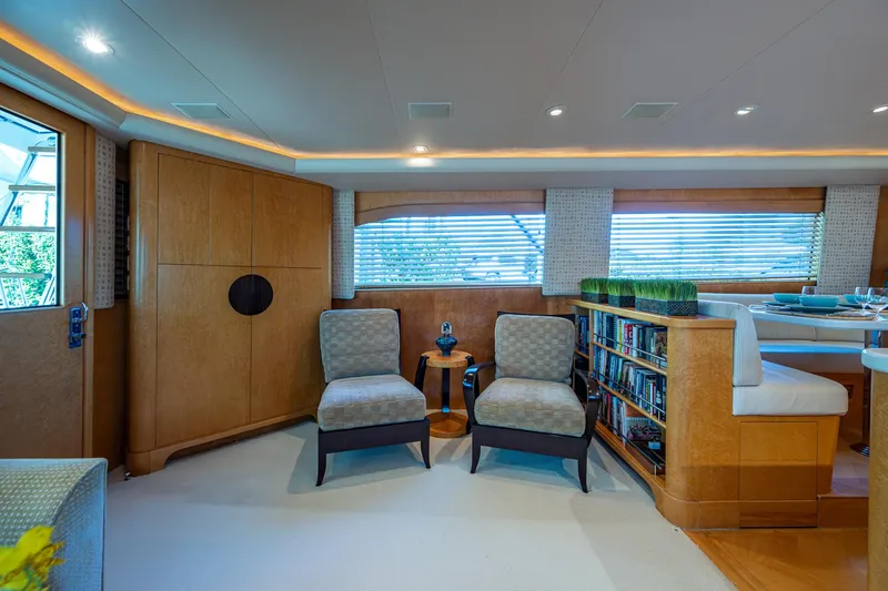 Slide: The Image of Luxurious 2001 American Custom Enclosed Flybridge interior with elegant seating and modern decor. - 36