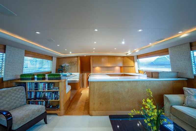 Slide: The Image of Luxurious interior of a 2001 American Custom Enclosed Flybridge yacht with modern furnishings. - 37