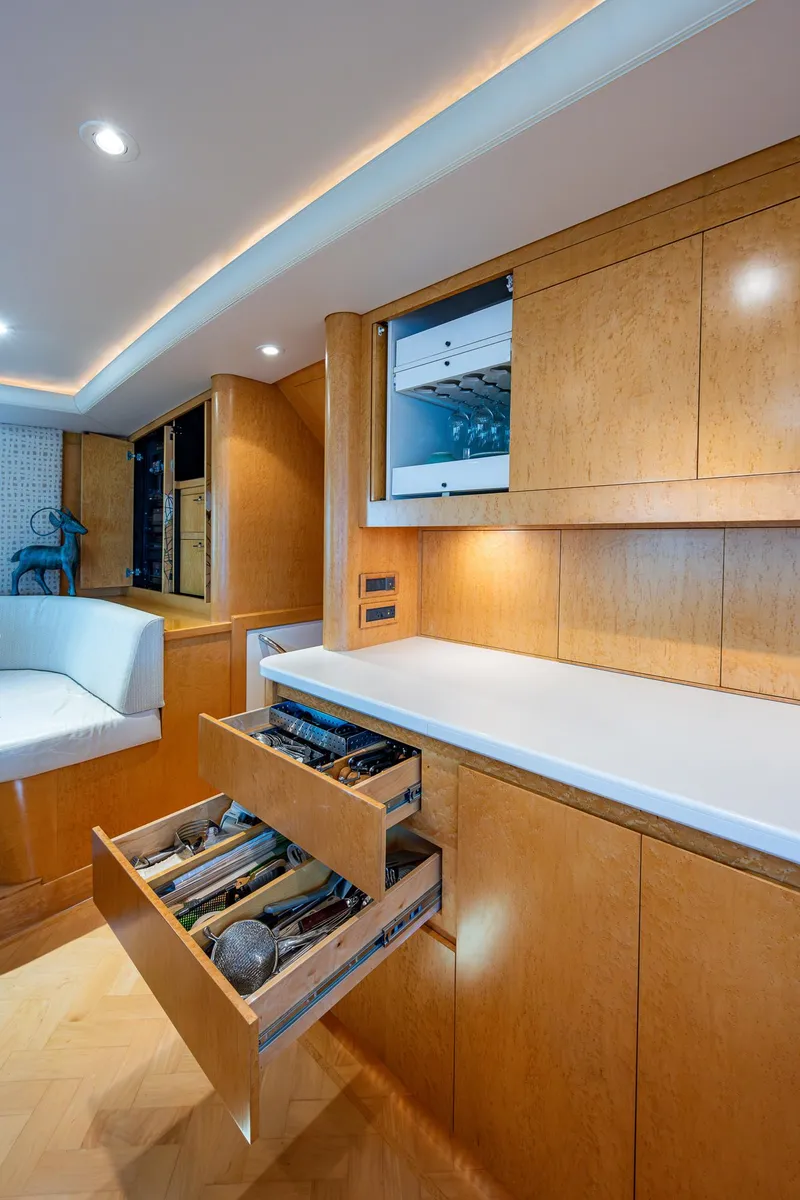 Slide: The Image of Luxurious 2001 American Custom Enclosed Flybridge interior with wooden cabinetry and modern amenities. - 41