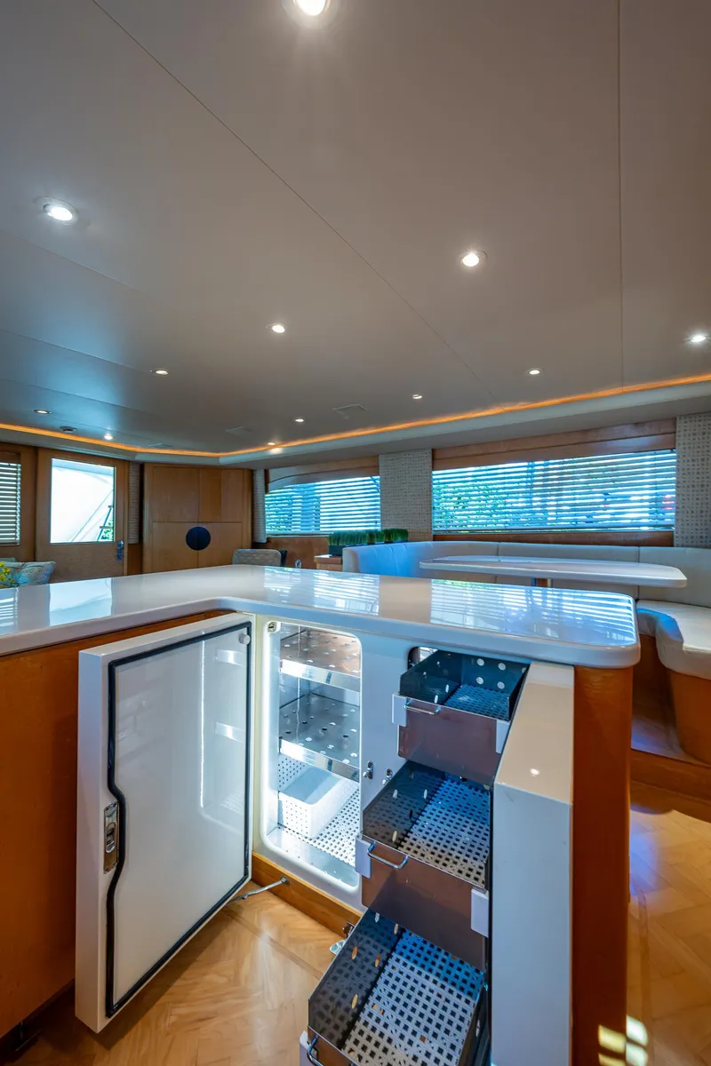 Slide: The Image of Luxurious interior of a 2001 American Custom Enclosed Flybridge yacht with modern amenities. - 43
