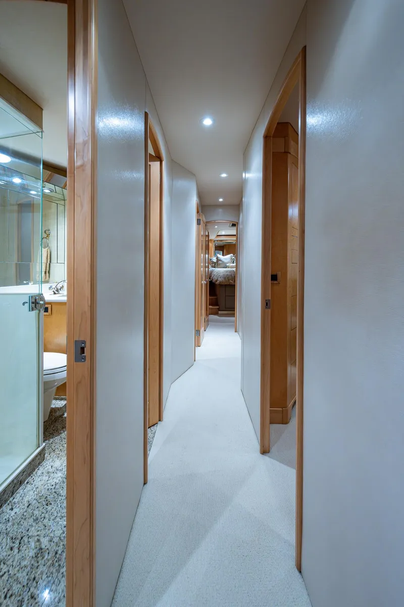 Slide: The Image of Interior hallway of a 2001 American Custom Enclosed Flybridge yacht, featuring modern design. - 46