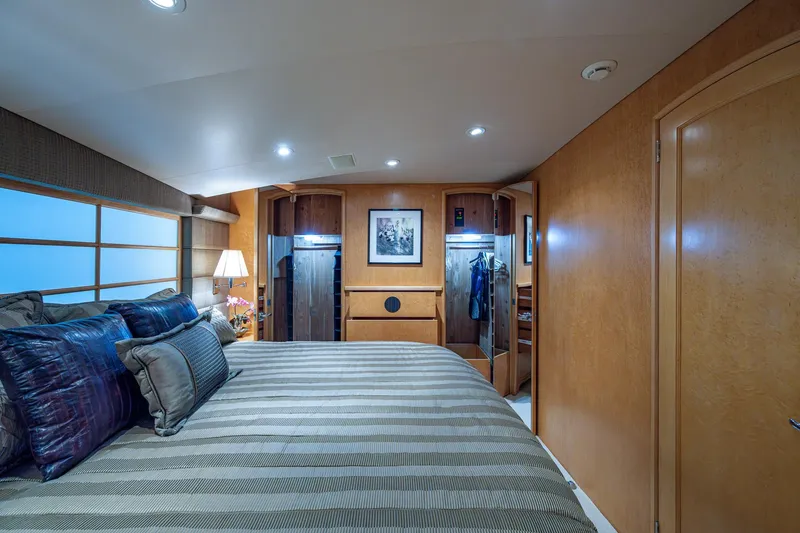 Slide: The Image of Luxurious bedroom interior of 2001 American Custom Enclosed Flybridge yacht with modern decor. - 49