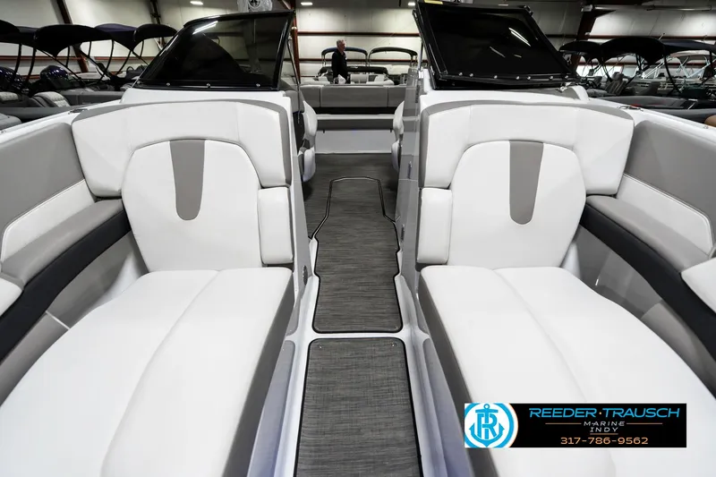 Slide: The Image of 2021 Four Winns H260 boat interior with sleek seating and modern design. - 19