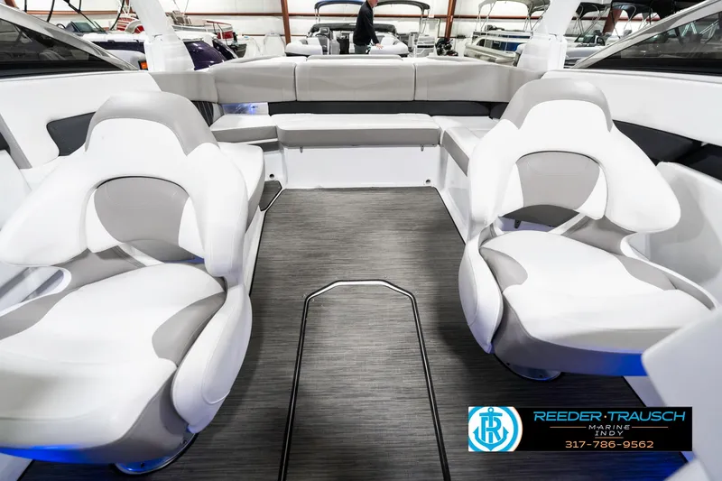 Slide: The Image of 2021 Four Winns H260 boat interior with modern seating and sleek design. - 20