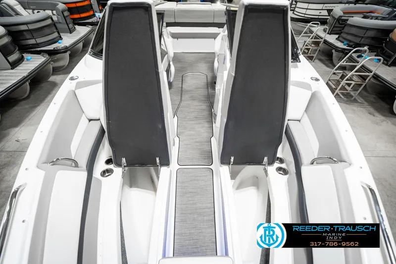Slide: The Image of 2021 Four Winns H260 boat interior with sleek seating and modern design. - 23